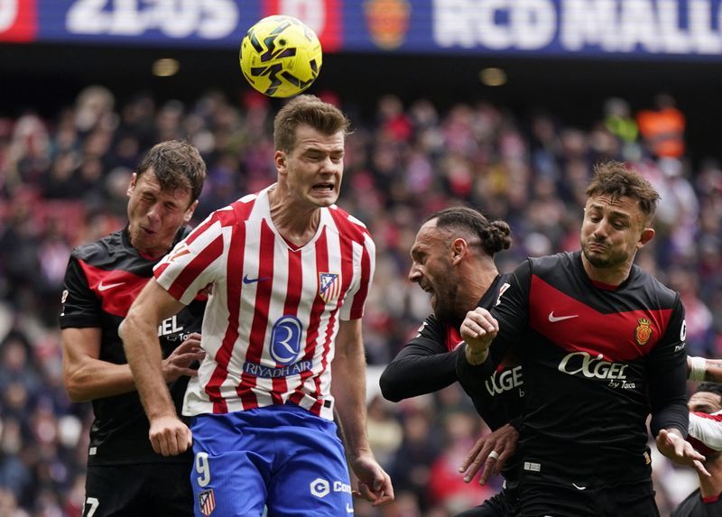 Soccer-Atletico ease past Mallorca to climb to third in LaLiga