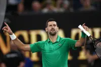 Tennis-Djokovic into Melbourne quarter-finals after Mensik pullout