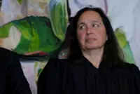 US judge blocks Trump administration's push to end legal status of 8,400 migrants