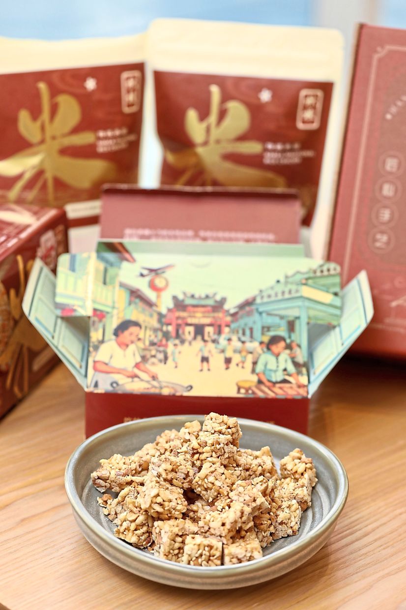 Le Chew Tradition Rice Cracker packaging with scenes from Kampung Baru Senai.