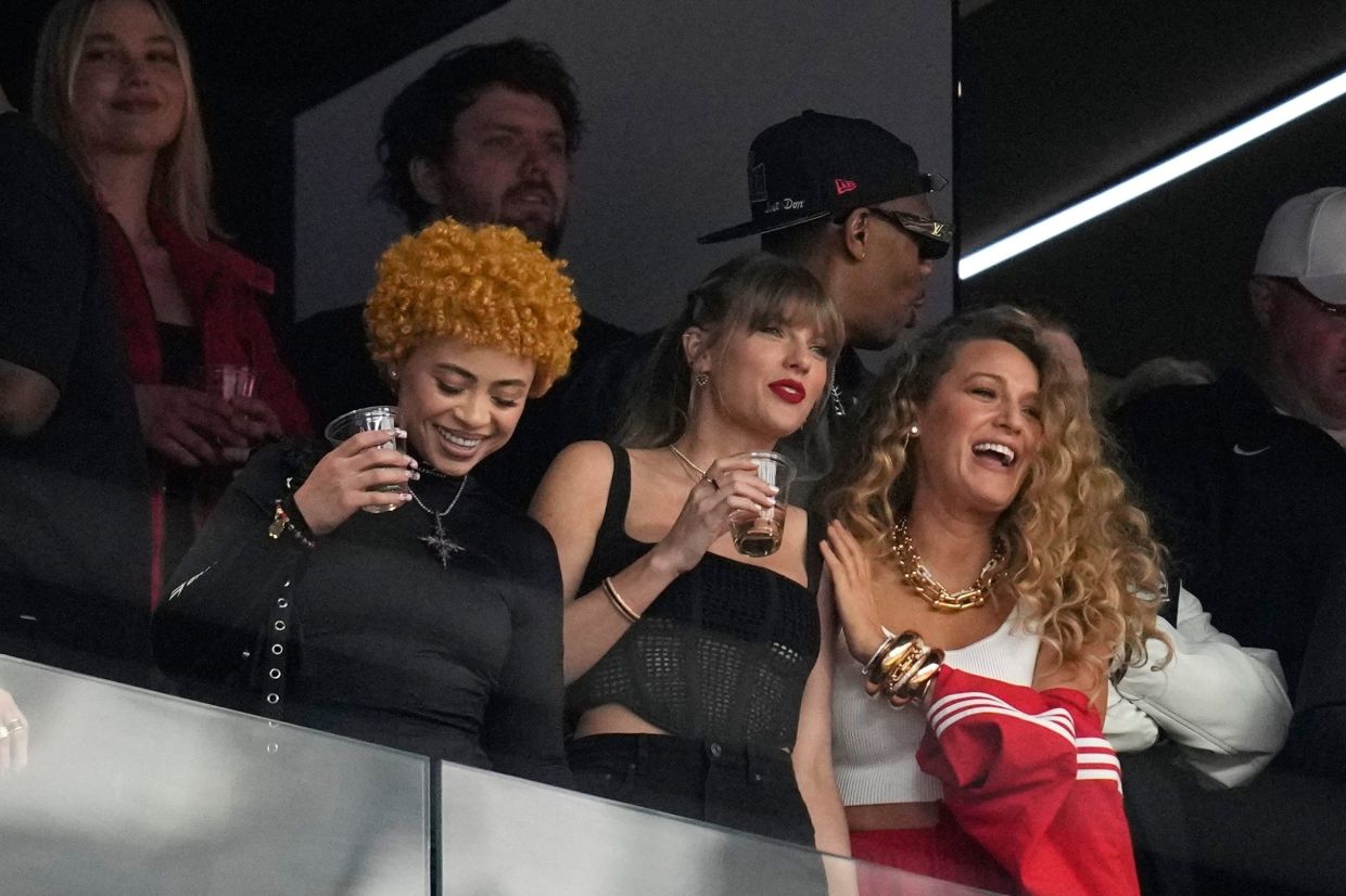 Taylor Swift (centre) watches the teams before the NFL Super Bowl 58 football game between the San Francisco 49ers and the Kansas City Chiefs with Ice Spice (left) and Blake Lively (right) Feb 11, 2024, in Las Vegas. Photo: AP