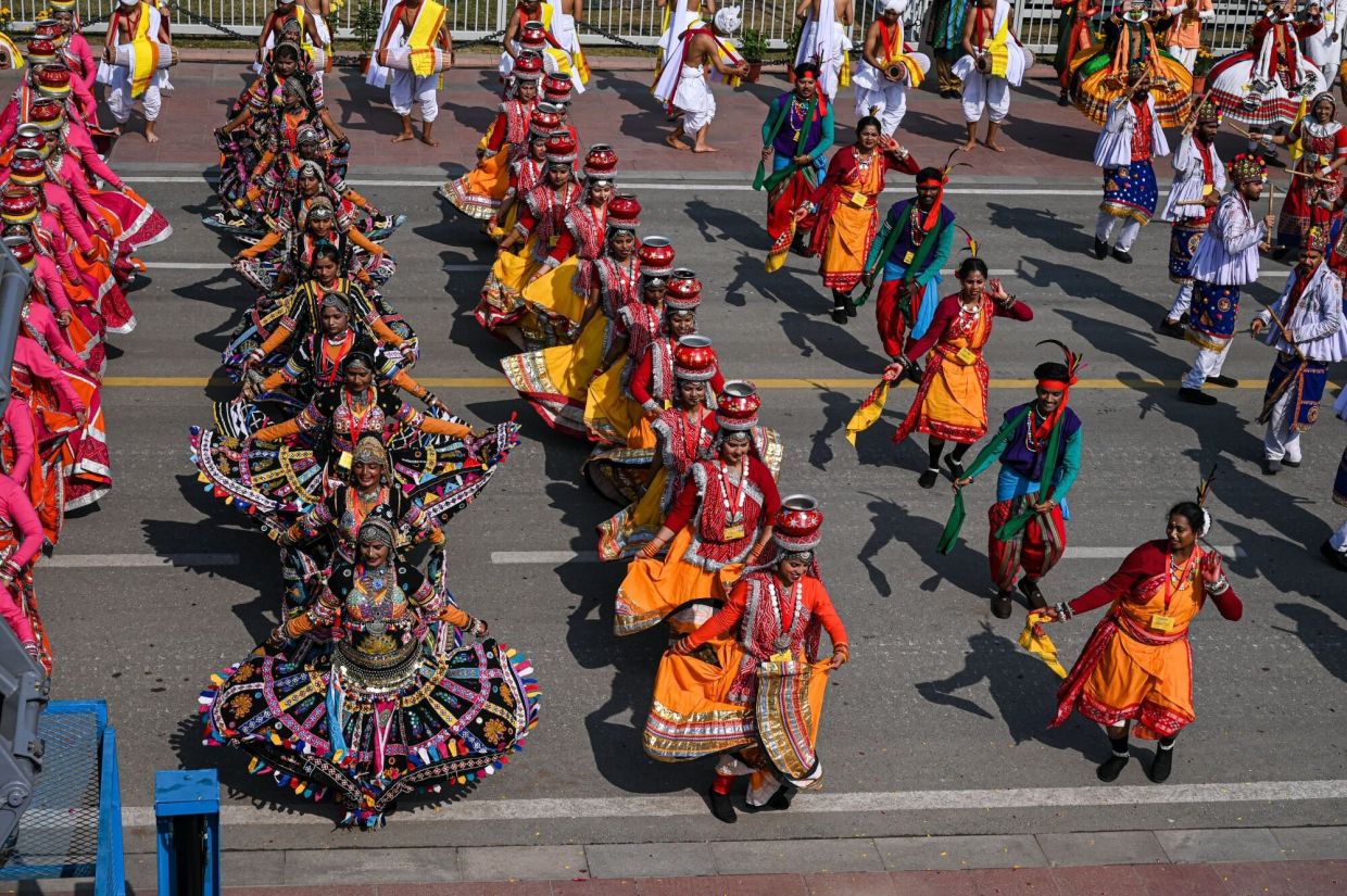 Folk dancers perform during the Republic Day parade at the ceremonial Kartavya Path in New Delhi, India, on Monday, Jan 26, 2026. The Indian government expects growth of over 7% in the current financial year, maintaining the nation’s status as the world’s fastest-growing major economy despite trade tensions with the US. -- Photographer: Prakash Singh/Bloomberg