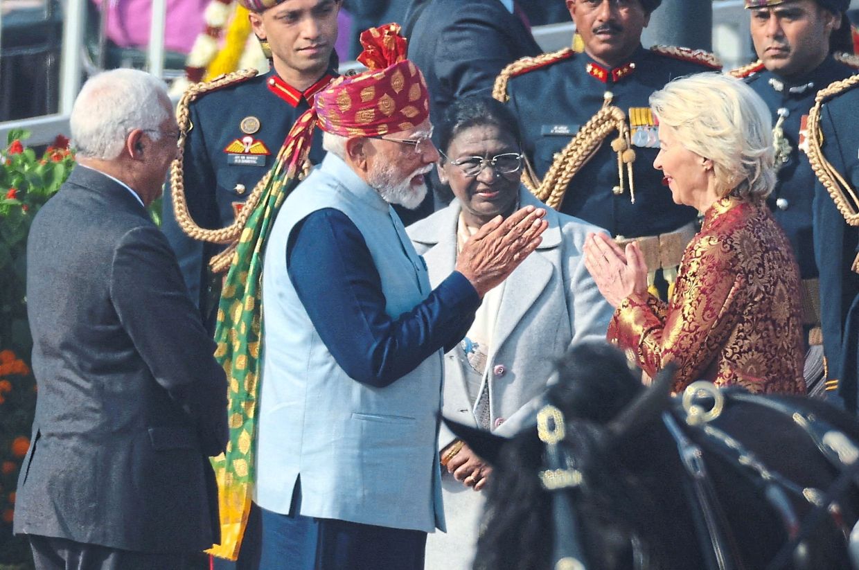 Guest of honour: Modi (left) greeting von der Leyen as India’s President Droupadi Murmu (centre) looks on at the Republic Day parade in New Delhi. — Reuters 
