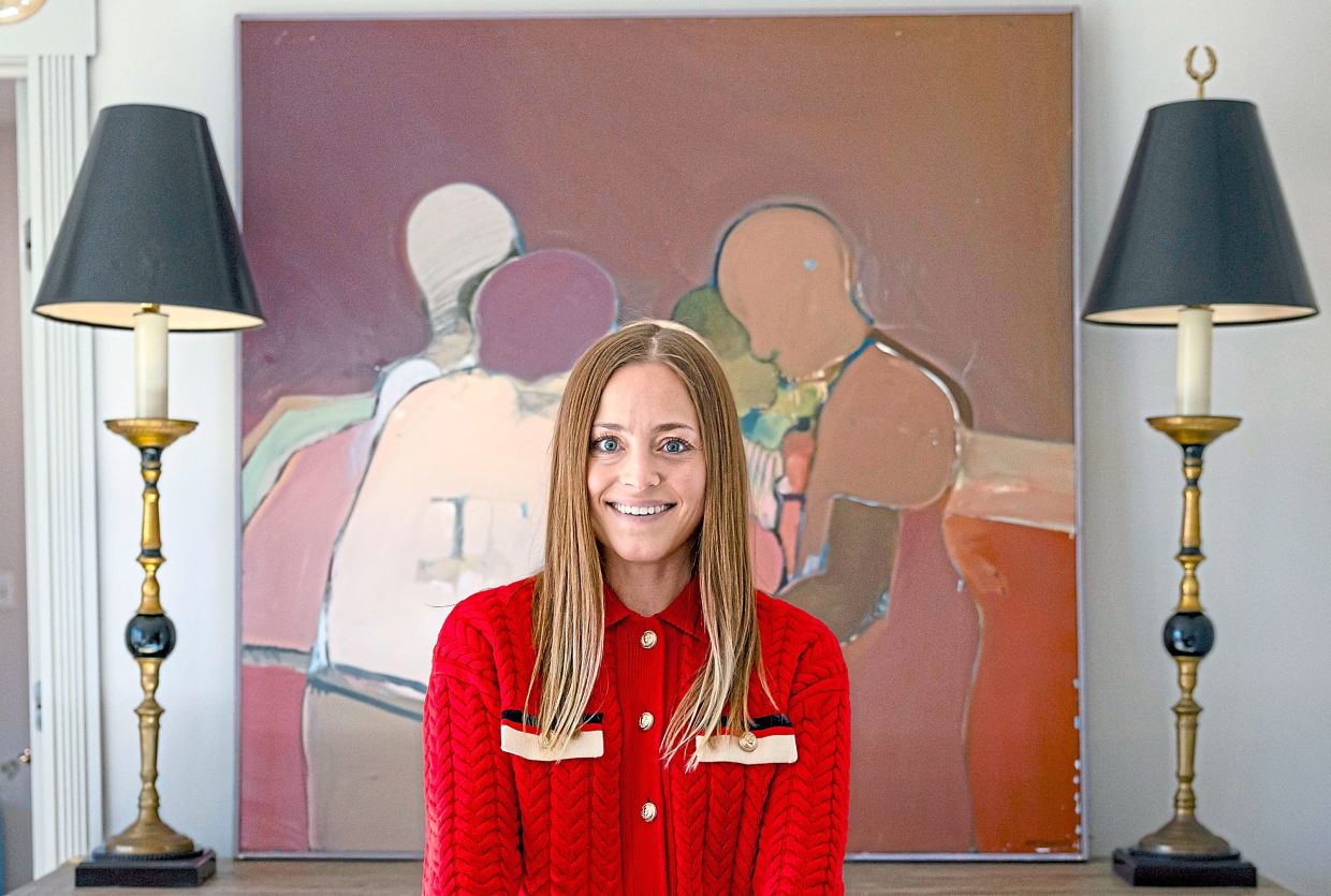 Von Mallinckrodt stands in front of a piece of art she found at the curb and now displays at home in Hinsdale.