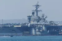 US aircraft carrier enters Middle East region, officials say