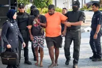 Friends claim trial to robbing woman, one charged with her rape