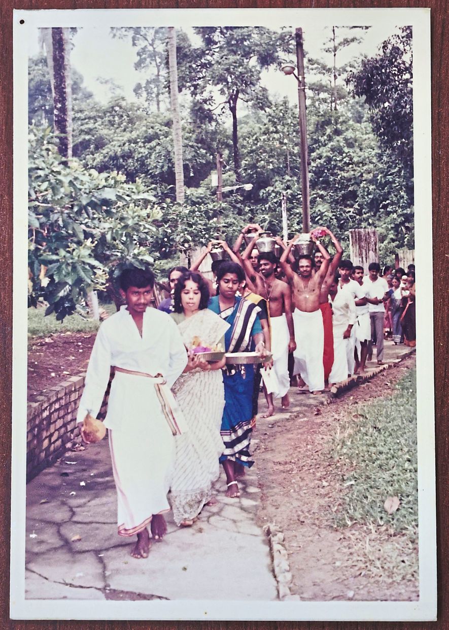 An undated image of devotees carrying milk pots and offerings to fulfil their vows during Thaipusam at the Waterfall Hilltop Temple.