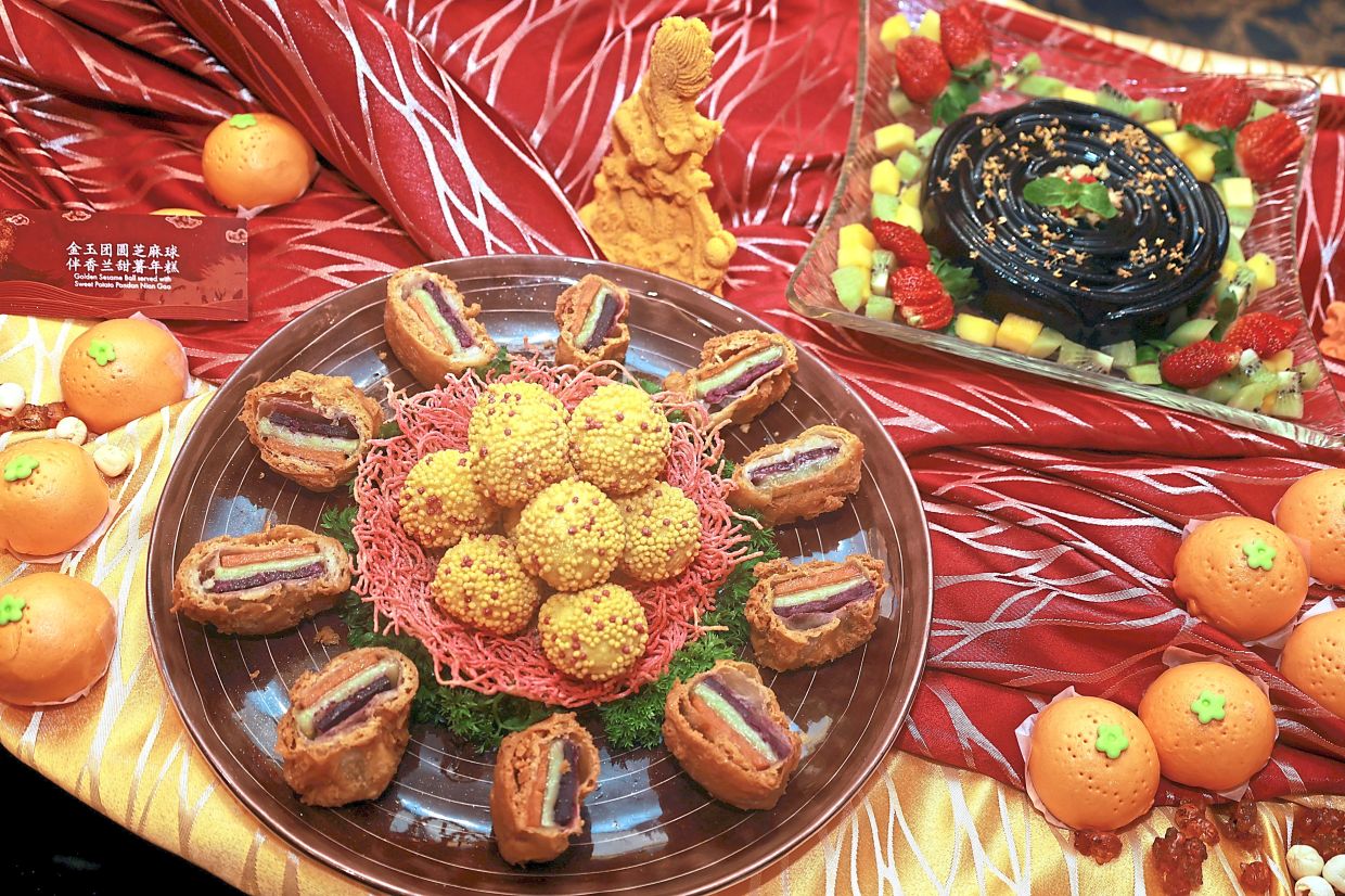 Desserts in the Wealthy Set comprise (left) Golden Sesame Ball with Sweet Potato Pandan Nian Gao, and Traditional Glass Jelly with Chrysanthemum Sorbet.