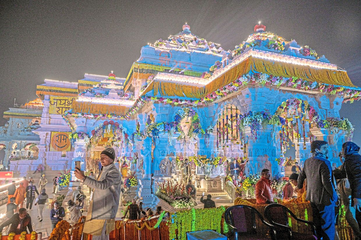 The Ram Janmabhumi Temple, which was built on the site of a mosque that had been torn down by a mob, in Ayodhya. — Atul Loke/The New York Times RSS volunteers listening to a speech at a celebration of the group’s centenary in Nagpur. With Modi at the helm of India, the century-old RSS is closing in on its dream of a muscular, Hindu-first nation. — Atul Loke/The New York Times
