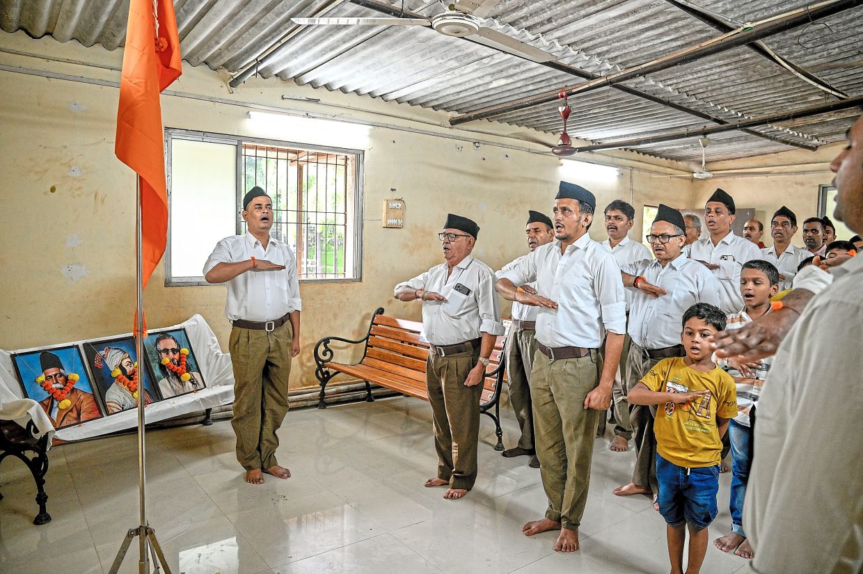 Volunteers for the far-right nationalist Rashtriya Swayamsevak Sangh hold a meeting in Mumbai on Aug. 9 2025. With Prime Minister Narendra Modi at the helm of India, the century-old RSS is closing in on its dream of a muscular, Hindu-first nation. (Atul Loke/The New York Times)