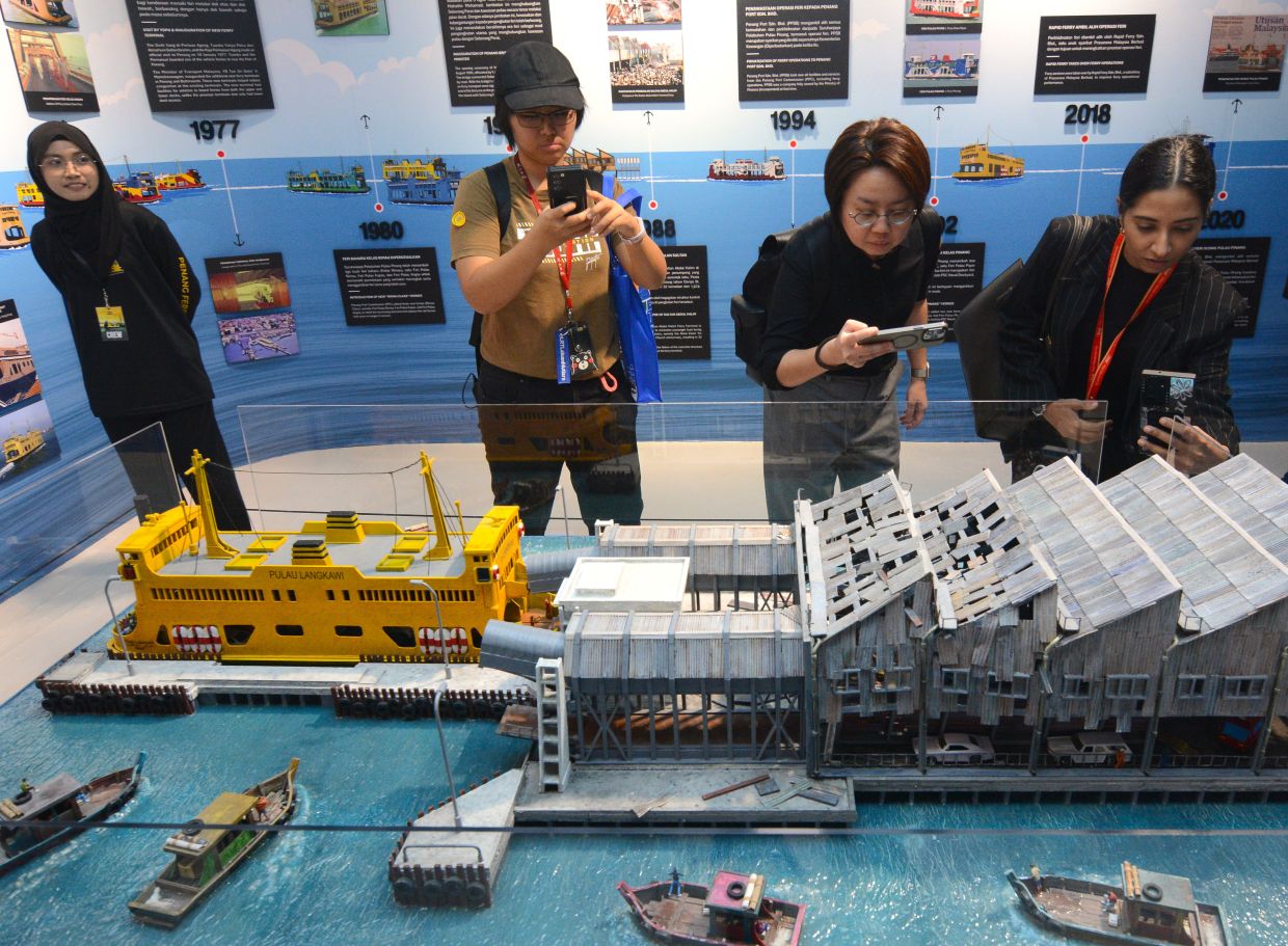 Visitors view a diorama of the Sultan Abdul Halim ferry terminal bridge collapse (July 31, 1988) at the Penang Ferry Museum. Photo: The Star/Zhafaran Nasib