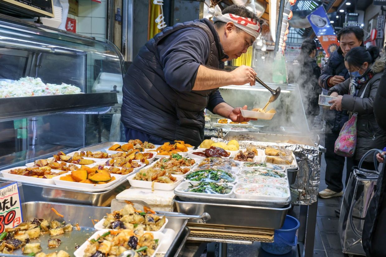 Japan PM's tax giveaway roils markets and worries voters