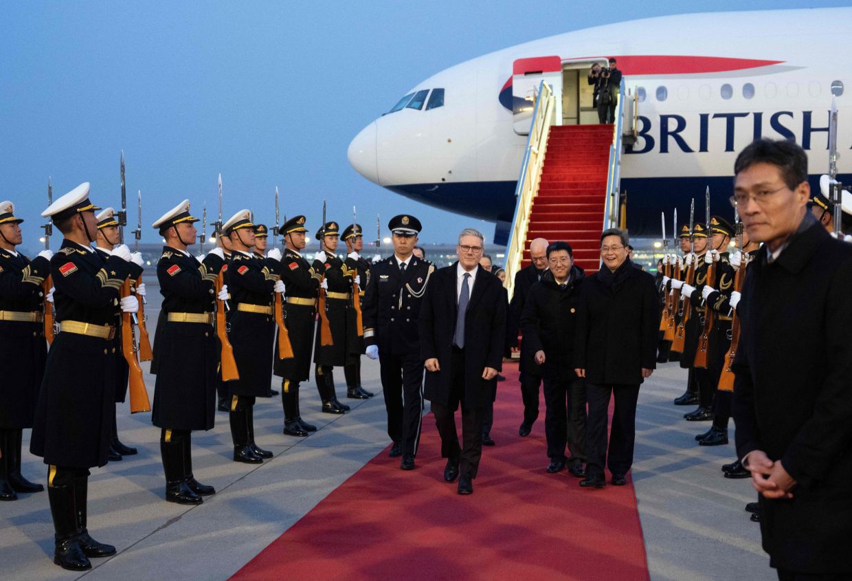 Britain's Prime Minister Keir Starmer being welcomed upon his arrival at an airport in Beijing on Jan28, 2026. Starmer arrived in Beijing on Jan 28 to meet with Chinese leader Xi Jinping, hoping to restore long fraught relations. - AFP