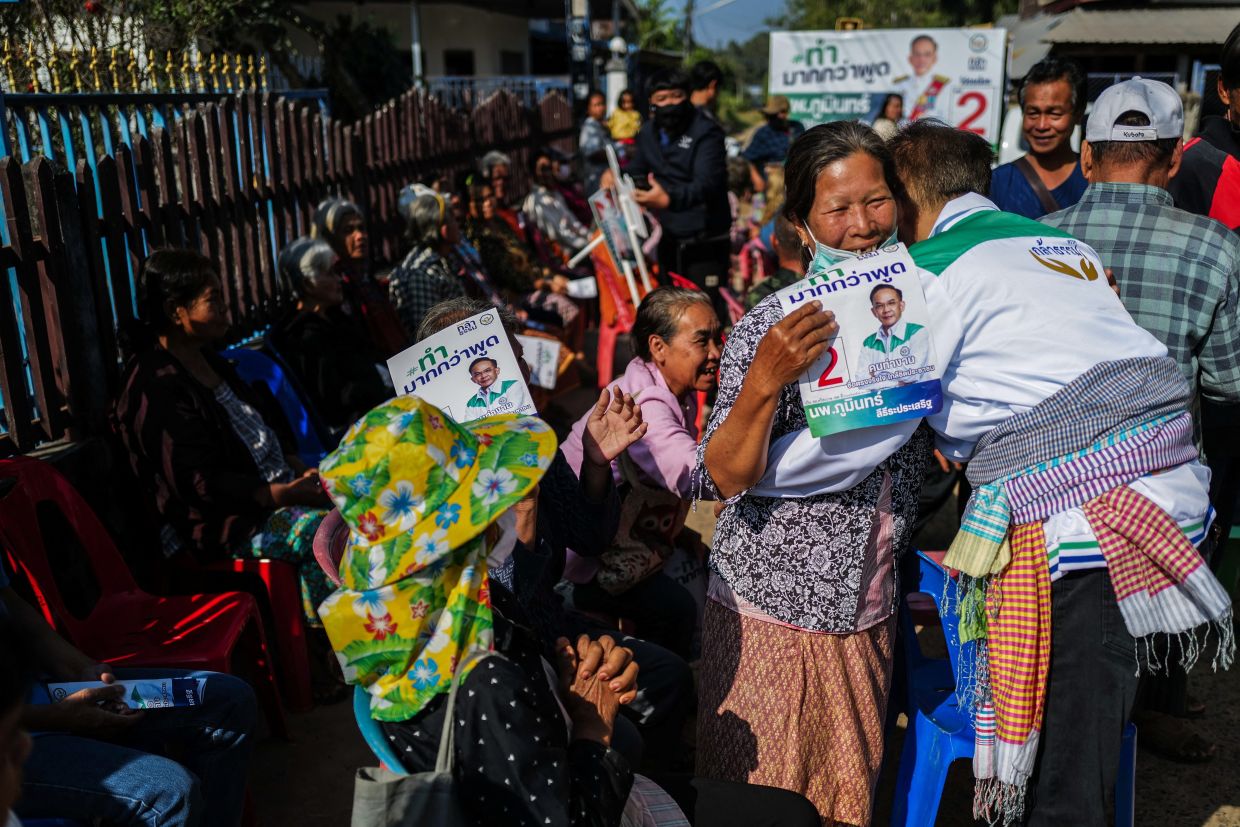 A woman hugging Phumin Leethiraprasert, 62, a parliamentary candidate for the Kla Tham Party in Si Sa Ket province and former member of parliament who switched from the Pheu Thai Party, during his election campaign ahead of Thailand's general election in Khuean Chang village in Kantharalak district, an area affected by clashes between Thailand and Cambodia, Si Sa Ket province. - Reuters