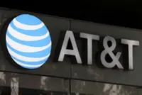 AT&T bets on fiber, spectrum deals to forecast annual profit above expectations