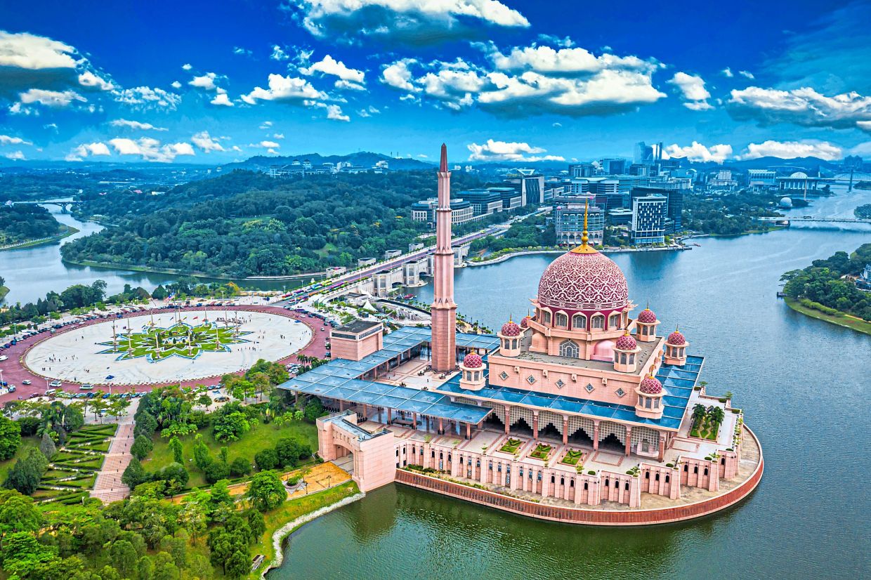Visit Putra Mosque in Putrajaya for its cultural significance and pretty pink facade. — Filepic
