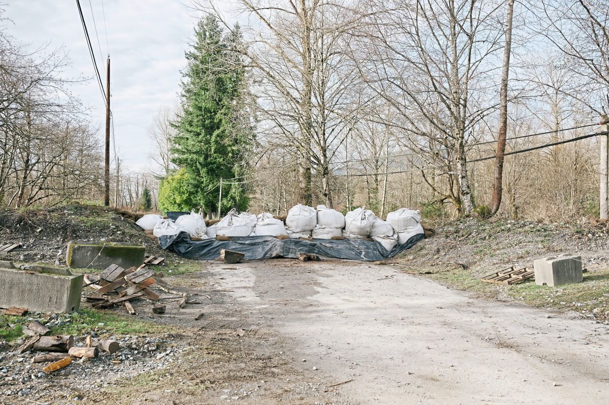 Sandbags used to support a levee in Hamilton, Washington. — Grant Hindsley/The New York Times