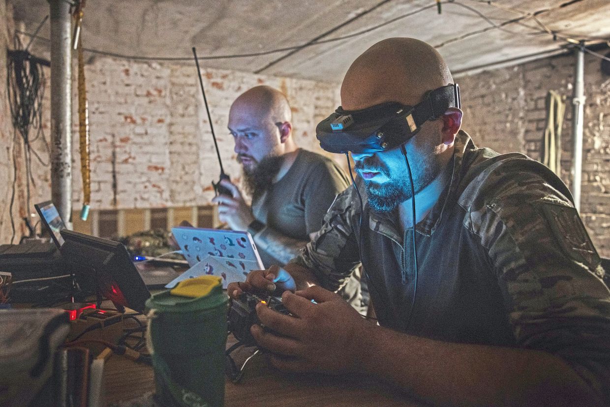 In this file photo, Ukrainian soldiers are seen flying armed first-person-view, or FPV, drones in the Kharkiv region of Ukraine on Aug 24, 2024. — David Guttenfelder/The New York Times