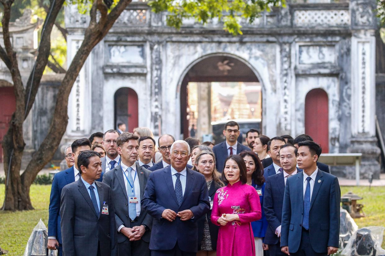 European Council President Antonio Costa (centre) visits the Temple of Literature in Hanoi on Jan 29, 2026 during his visit to Vietnam. - AFP