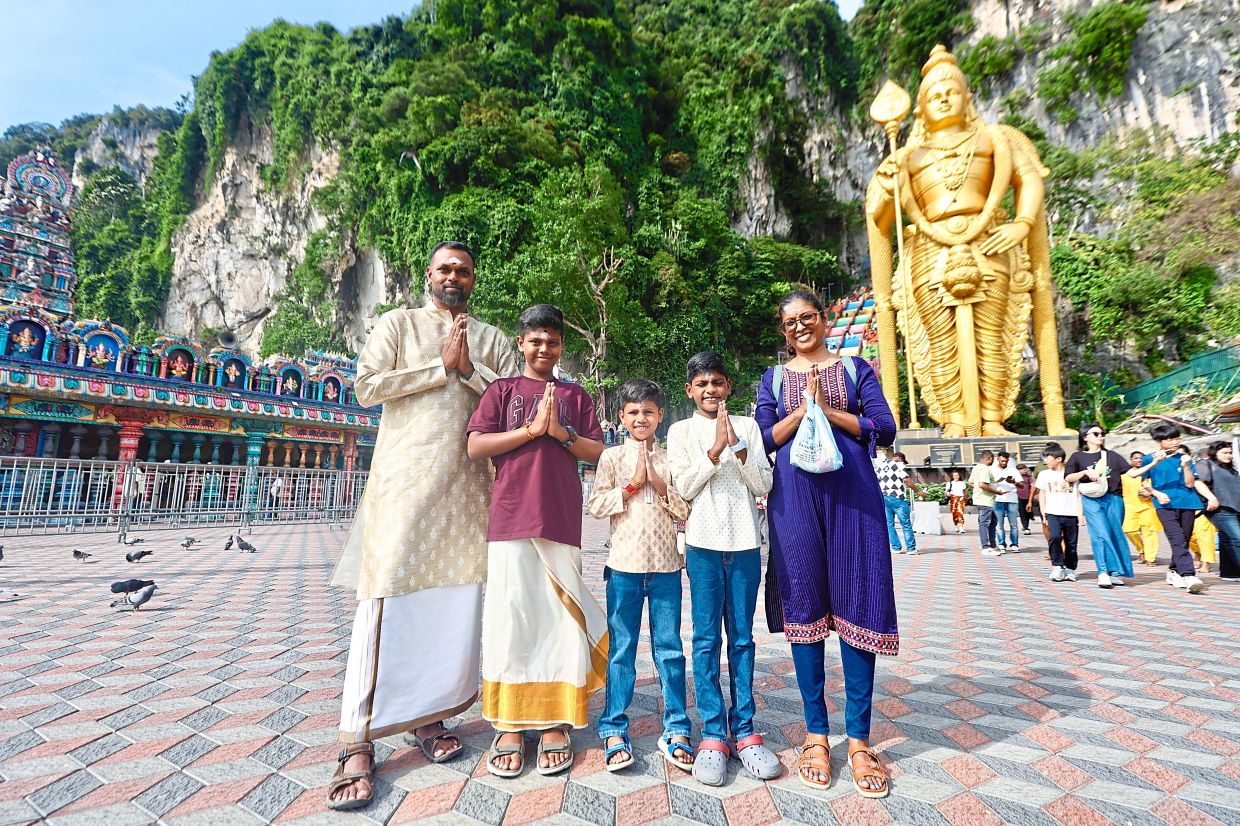 (From left) Thurai Singam, Theiiveeghan, Addhavan, Joshuant and Judy Maria visiting Batu Caves early to avoid the crowd.