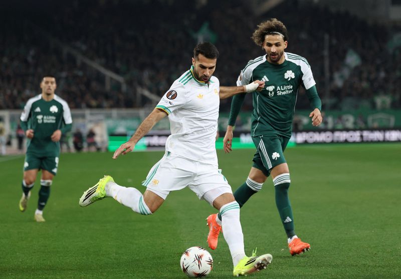 Soccer-Lyon top Europa League standings, Roma through to last eight