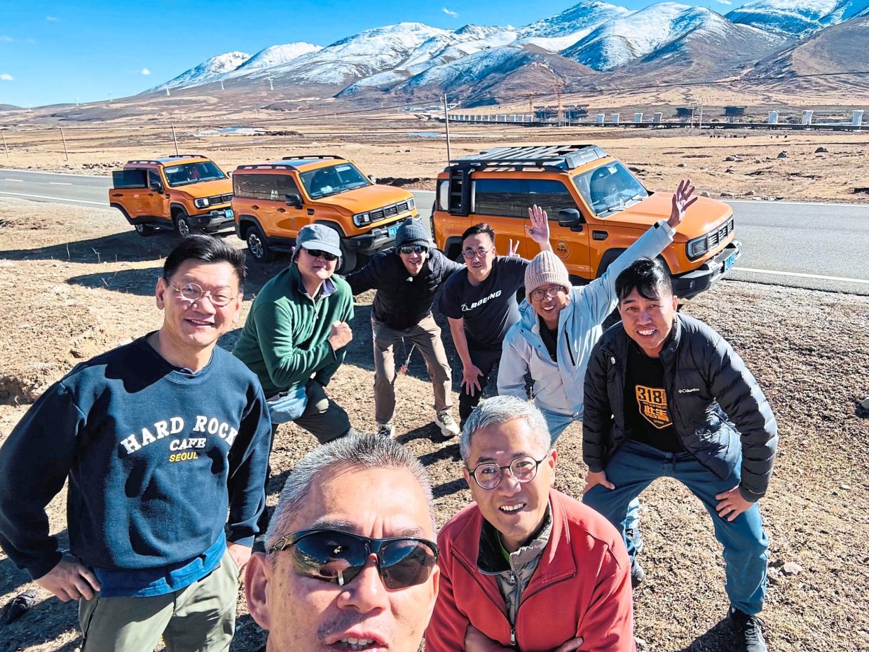 Eight former classmates converged in Chengdu in early November 2025 to tackle the legendary G318 highway to Lhasa. (Front row from left) Yeap Boon Leong and Teh Song Lai together with (Back row from left) Ong Lay Tatt, Ho Eng Ban, Foong Hong Chuen, Ooi Kooi Keat, Wai Kok Chin and Loo Choo Hin. — Photos: OOI KOOI KEAT
