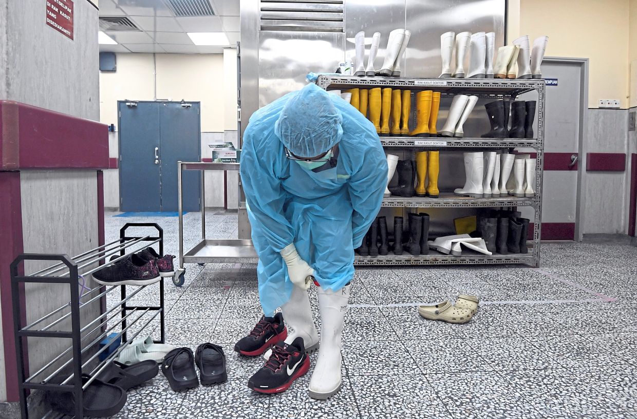 Wellington boots are a critical safety measure in the autopsy suite to protect against blood and bodily fluid spills as the environment involves significant amounts of fluids on the floor.