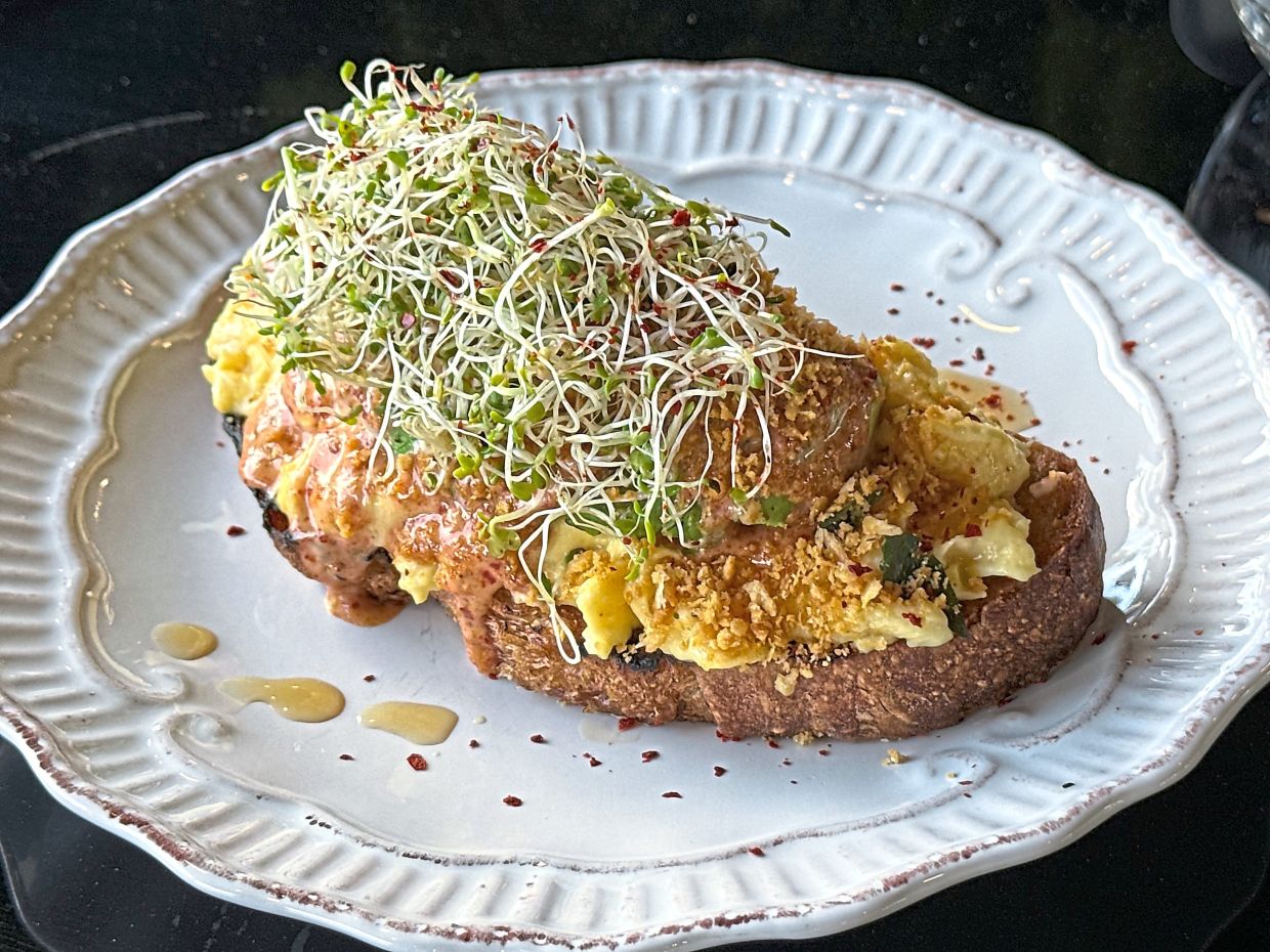 Sunrise avocado is a hearty yet healthy brunch offering that makes for a great way to start your day. — MICHAEL CHEANG/The Star