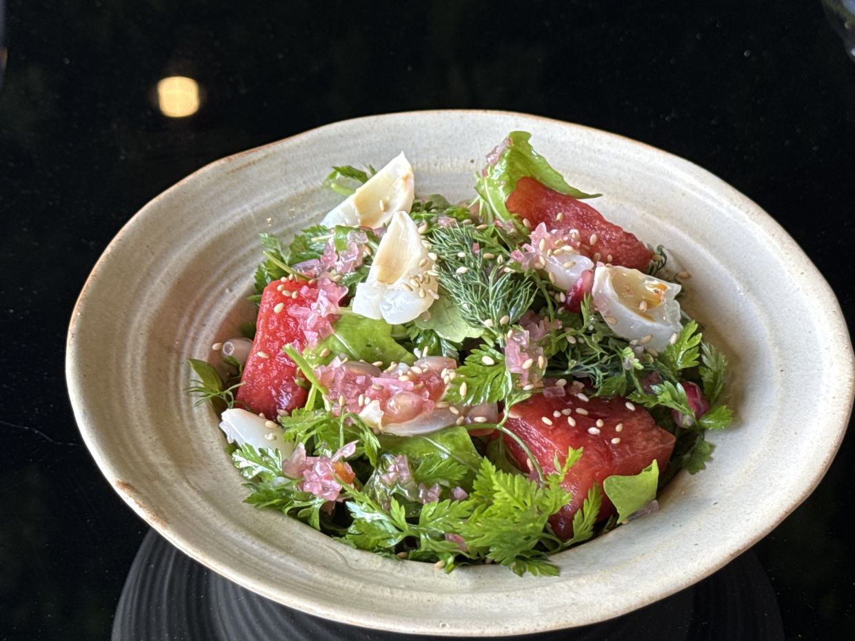 The watermelon salad is a light, refreshing affair buoyed by the smokiness of the grilled watermelon. — MICHAEL CHEANG/The Star