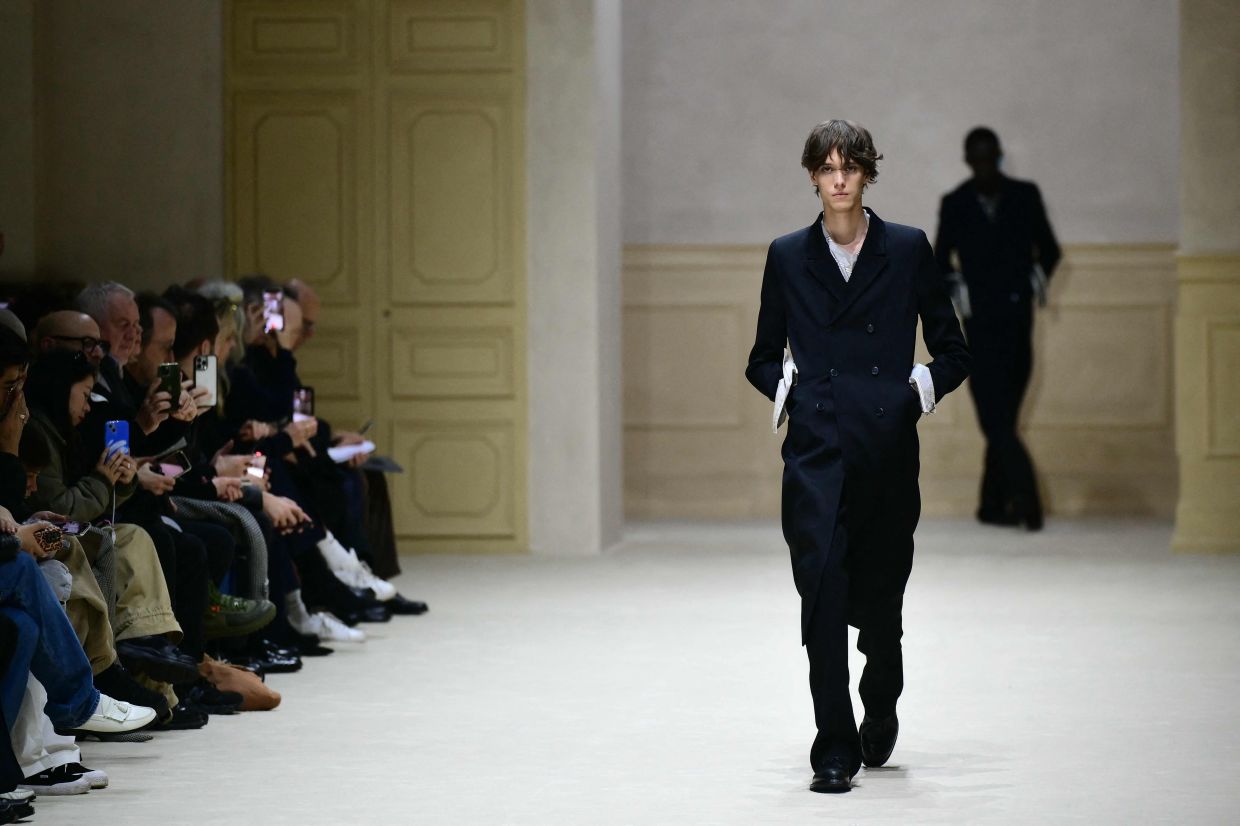 Paris swings between baggy excess and razor-sharp tailoring on menswear runways