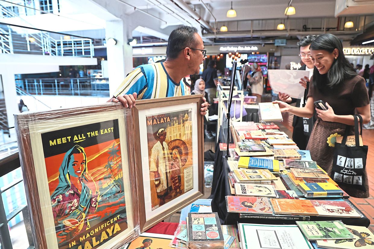 Alaudin Shahidan, who runs the collectible books pop-up Tinta Lama, observes that readers are eagerly exploring Malaysia’s rich literary heritage. Photo: The Star/Azman Ghani