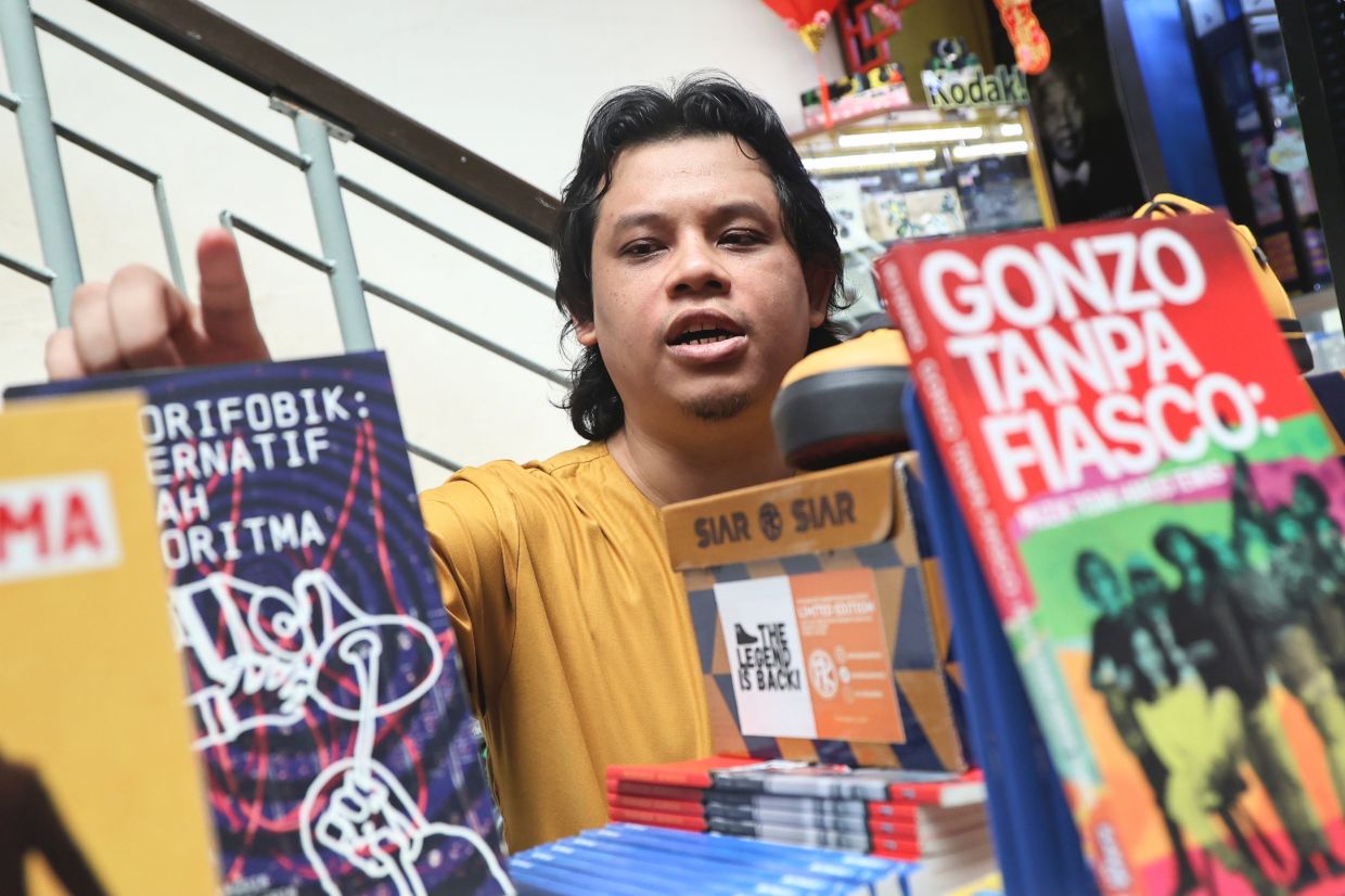 Ku Syafiq, a pop culture writer, regards the KL Alternative Bookfest as a valuable platform where indie publishers can also gain visibility and connect with new readers. Photo: The Star/Azman Ghani