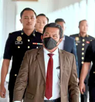 Ex-spy chief denies graft charges
