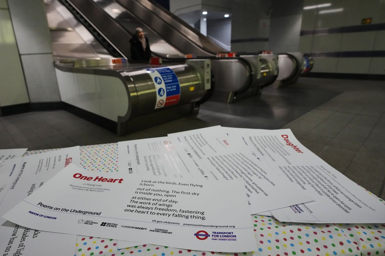 Poems are laid out on a table at a gathering to celebrate 40 years of 'Poems on the Underground' in London. Photo: AP