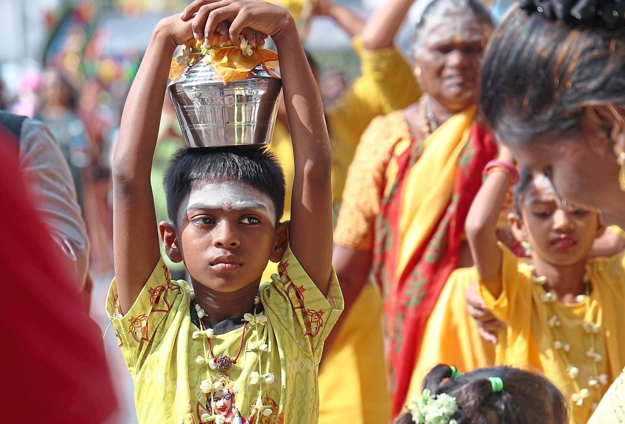 Young devotees: Children carrying ‘paal kudam’ at Batu Caves.