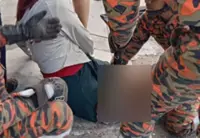 Penang bomba rescue woman with leg trapped in drain cover