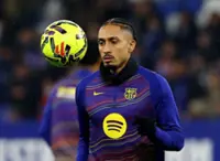 Soccer-Barcelona's Raphinha out for a week with leg injury