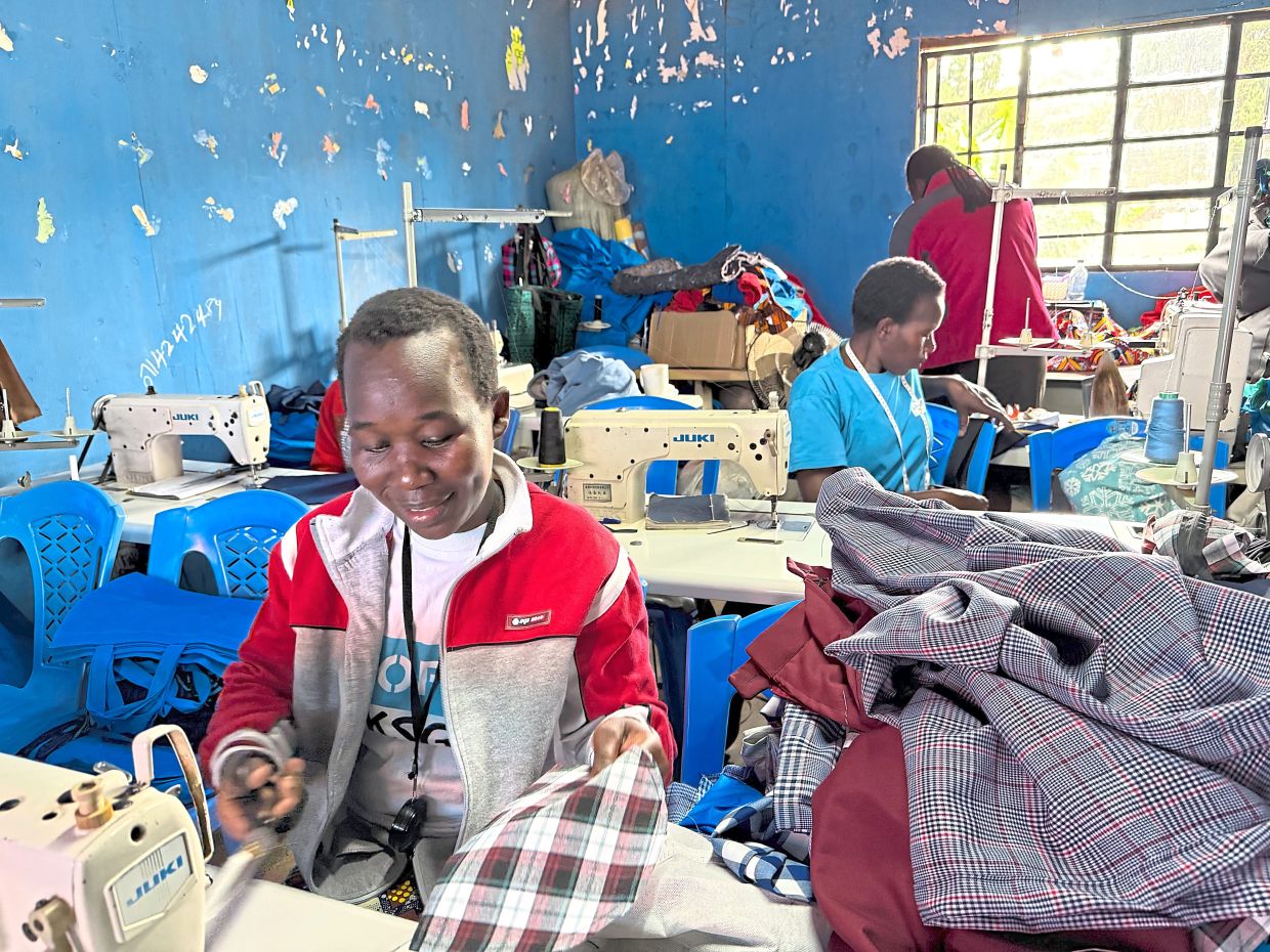 Kibera residents in training in a sewing workshop run by Shofco.