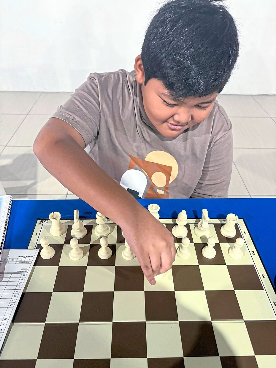 Chess is helping Muhammad Nur Raziq improve his focus, patience and confidence. 