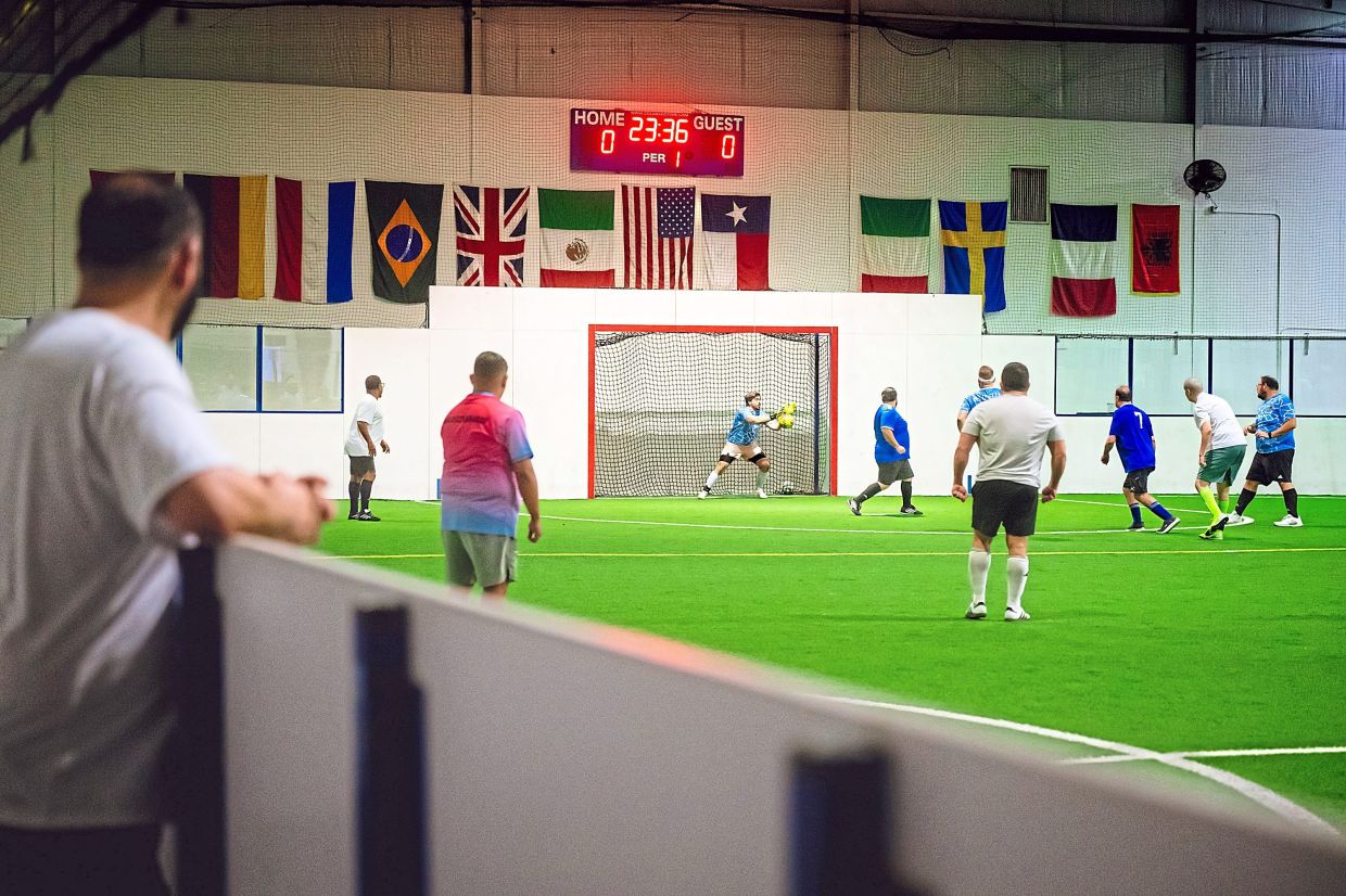 Fat Man United team competes against Totten-Ham and Cheese team during a Man v Fat league game.