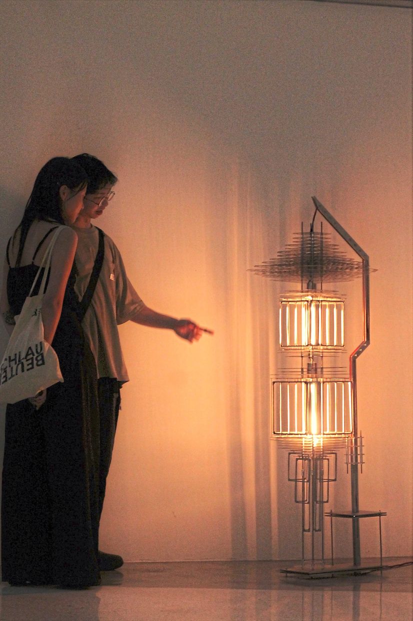 Visitors view Wong’s installation titled 'Axis'. Photo: The Star/ M. Irsyad 