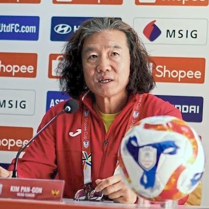 Going all out: Kim Pan-gon speaking to reporters during the press conference.