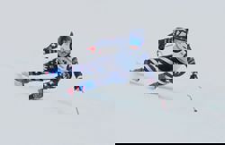 Olympics-Fur coats, mobster chic and flowing turns: Cortina works for Wiles