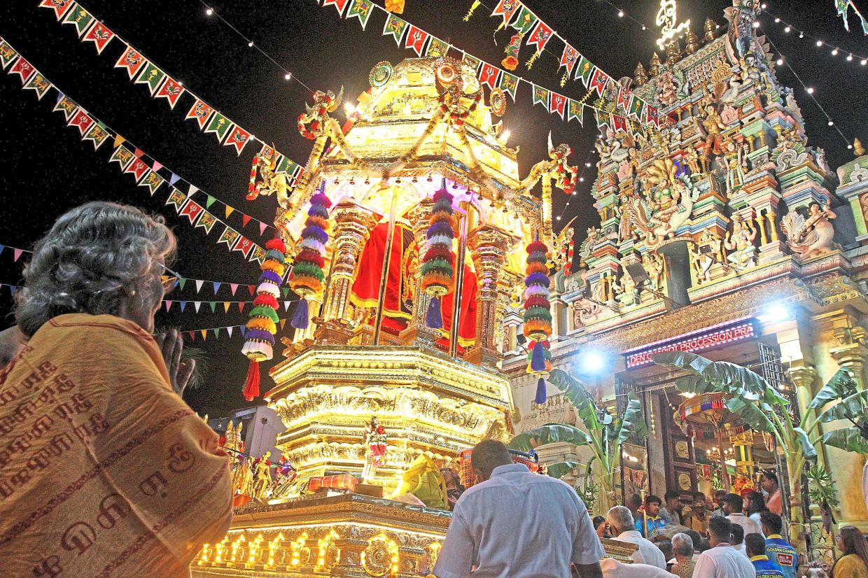 The golden chariot carrying the divine spear called ‘Vel’. — Photos: LIM BENG TATT and ZHAFARAN NASIB/The Star