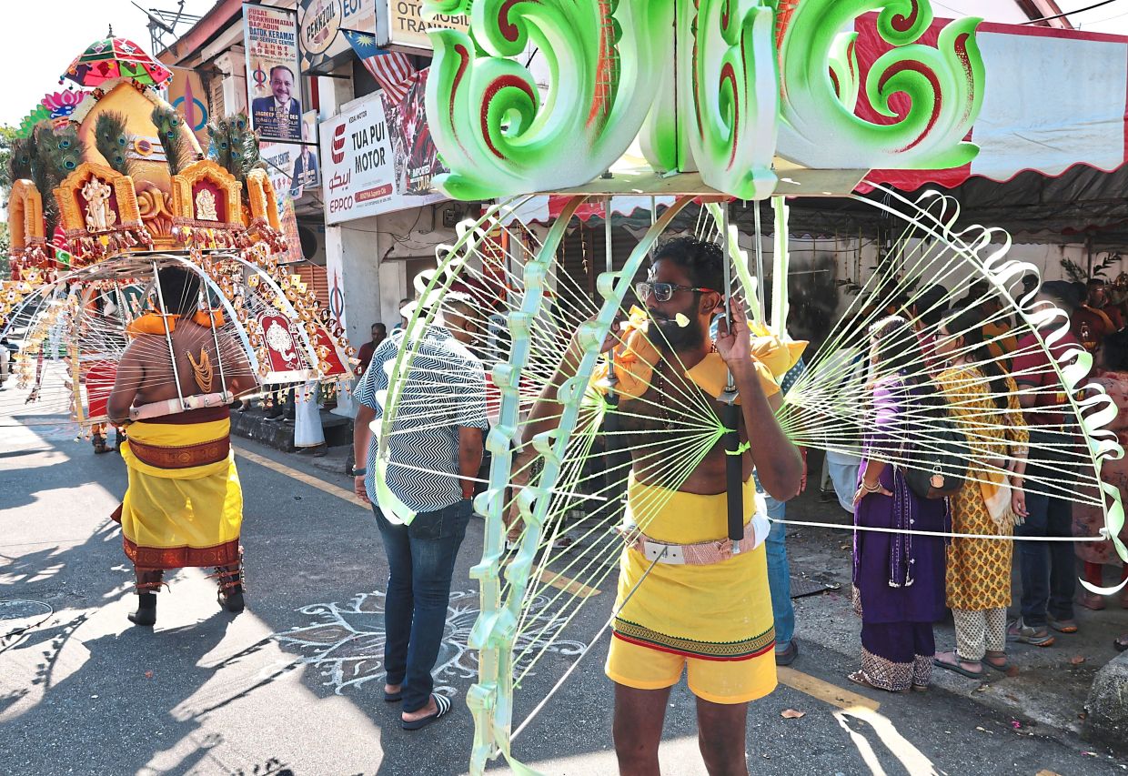 Dr S. Arravinnath carrying a kavadi for the first time, fulfilling a vow made for his mother’s recovery from illness.