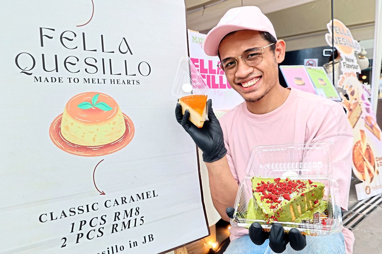 Muhammad Firdaus holding the classic caramel flavour in his right hand and the strawberry matcha flavour in the other.
