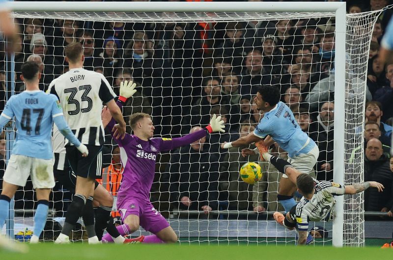 Soccer-Ruthless Man City thump Newcastle to reach League Cup final