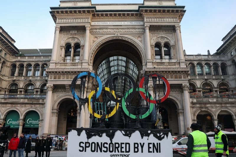 Olympics-Greenpeace stages protest in Milan as torch arrives in the city