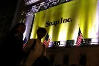Snap reports upbeat revenue as holiday season fuels ad sales