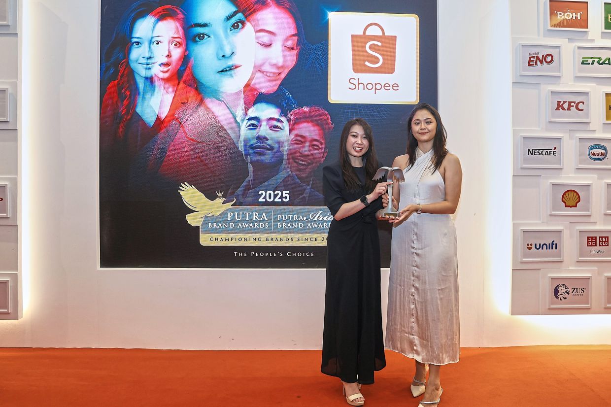 Shopee brand and communications manager Pang Li Yin (left) with a gold in the e-Commerce category.